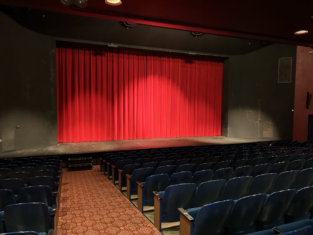 The Forum Theater stage with curtain drawn