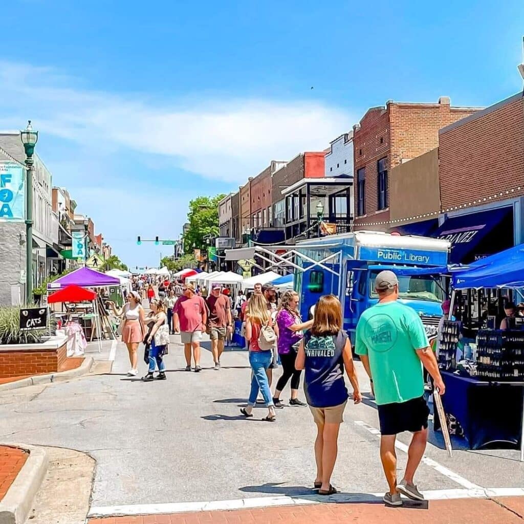 People walking in downtown Jonesboro, Arkansas during the Oasis Arts & Eats Festival