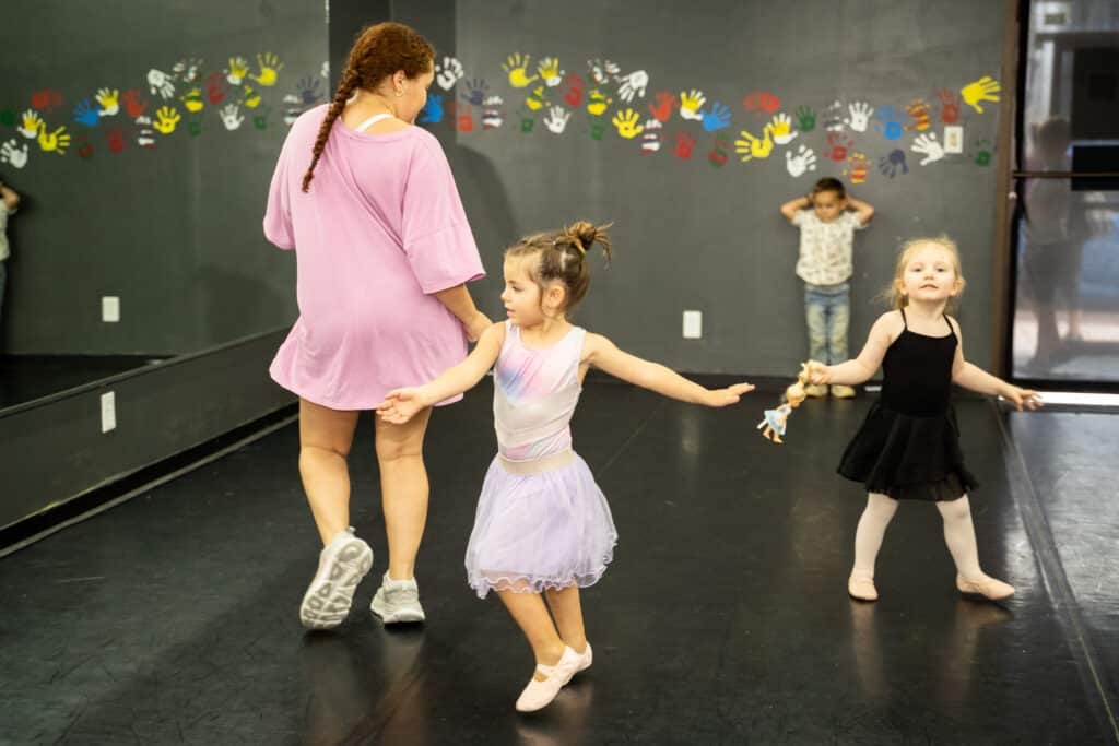 girls doing ballet in a dance studio at The Arts Center